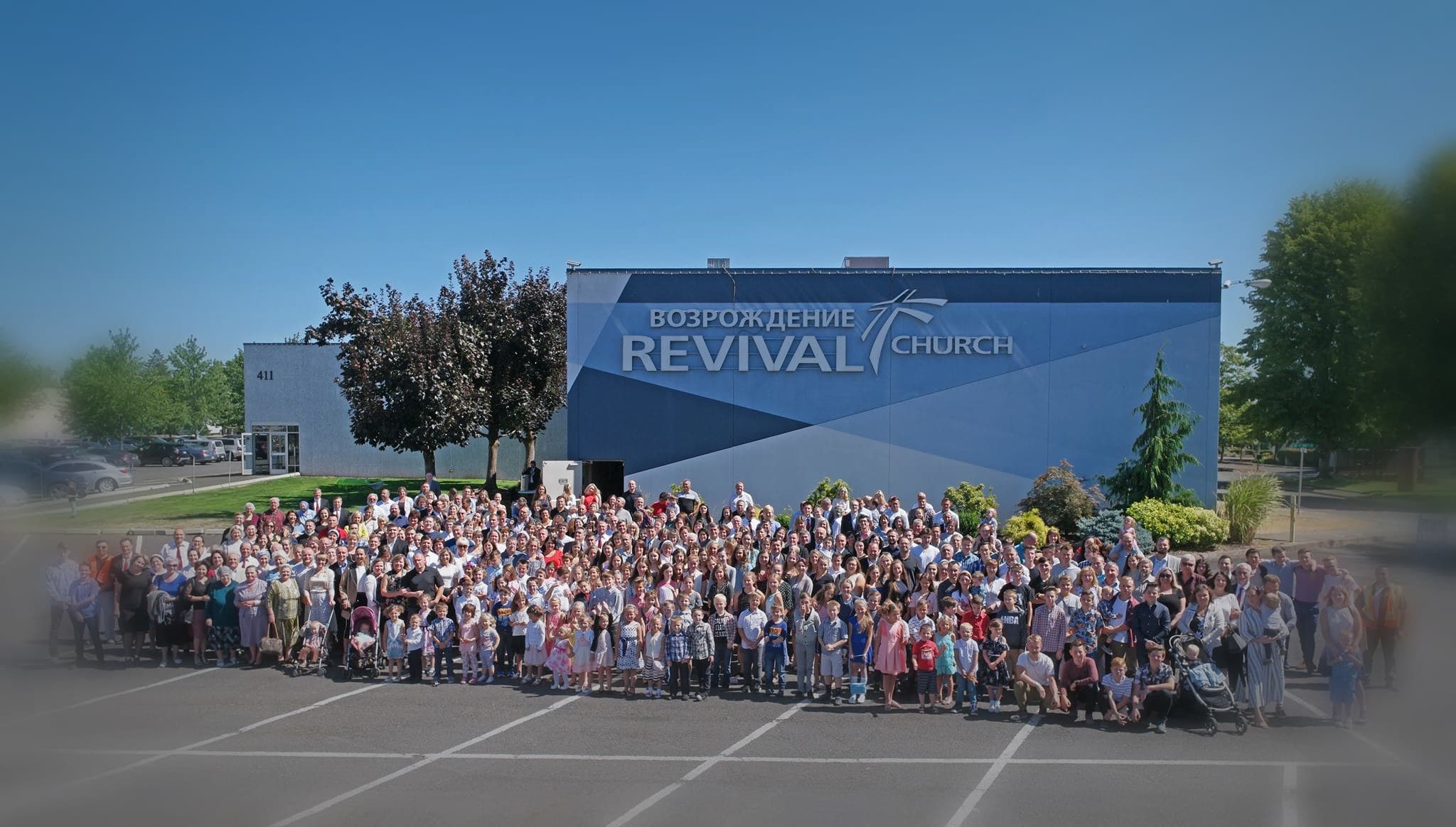 Revival Church community gathered outside the church building